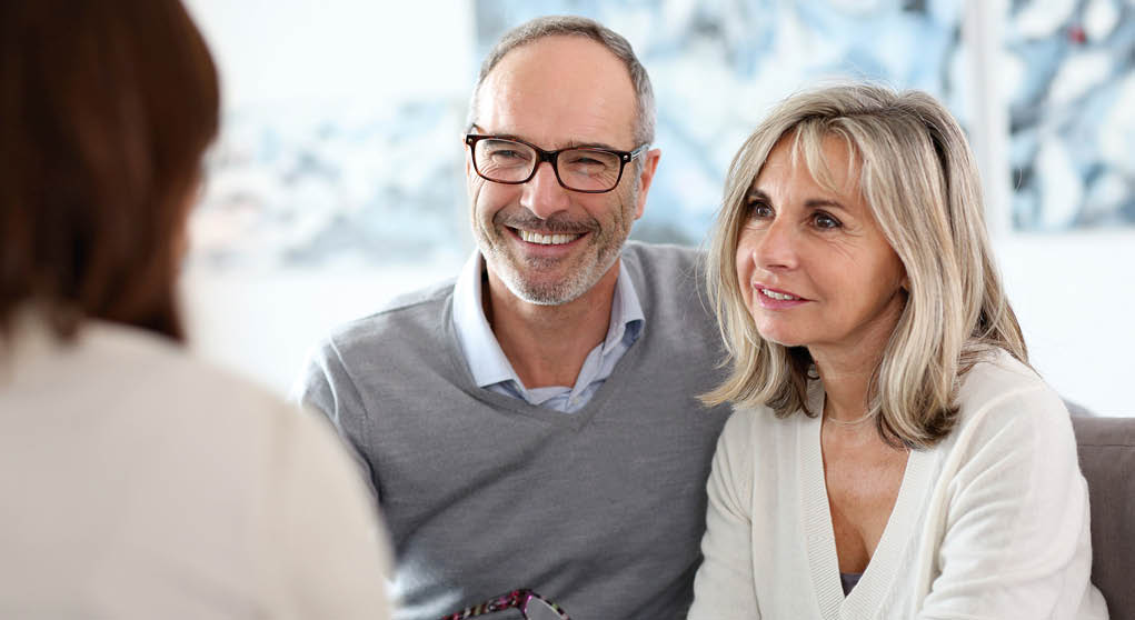 Senior couple meeting financial adviser for investment