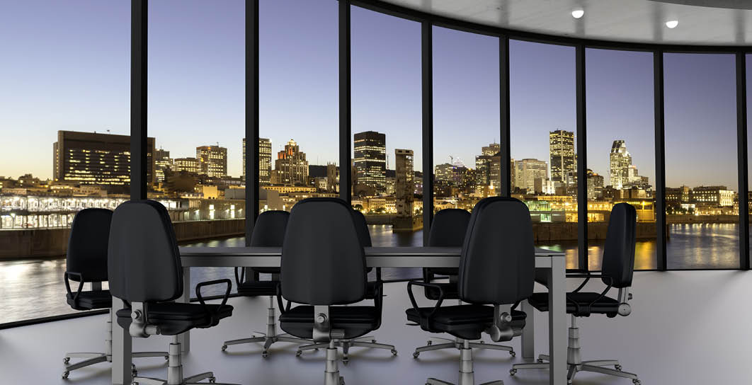 modern office / conference room with view over the downtown skyscrapers at night